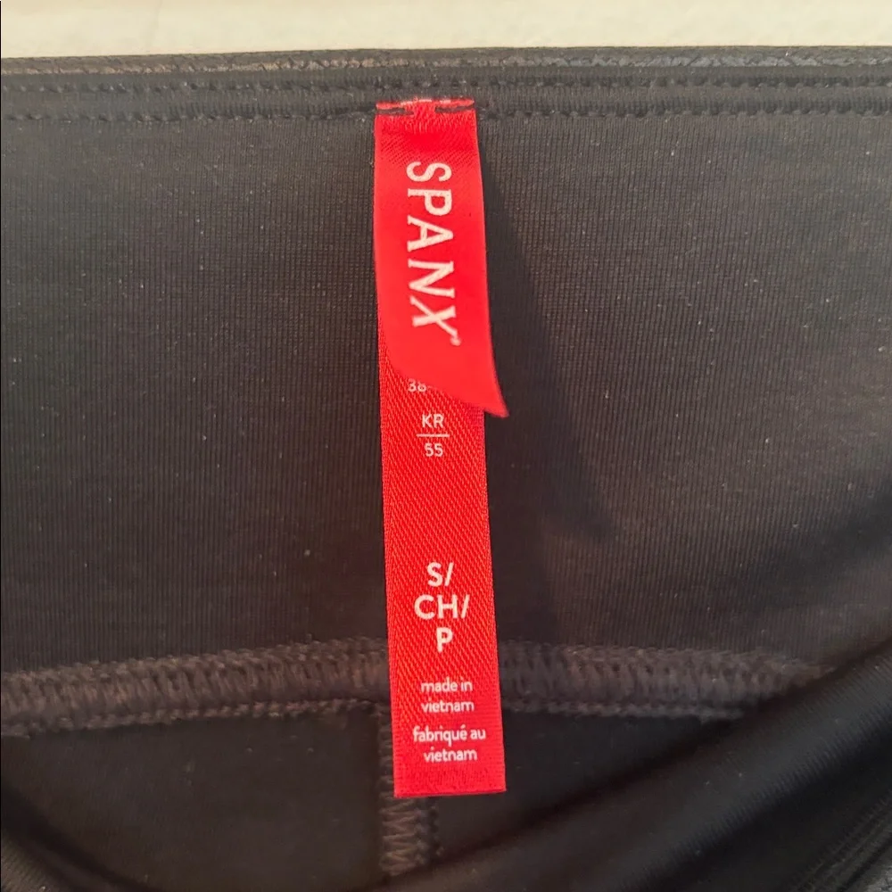 Spanx Women’s Black Faux Leather Leggings in a size Small.